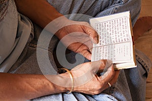 Sikh reading Gurbani closeup photo
