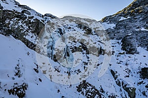 Siklawa Wielka Siklawa - The largest waterfall in Poland in winter scenery. Tatra Mountains