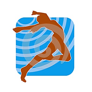 Silhouette of a female ballet dancer in action pose.