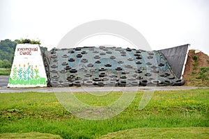 Silage trench from combined concrete goods. Territory of livestock economy. The Russian text - a corn silo