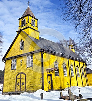 Silenai old wooden yellow church, Vilnius district, Lithuania