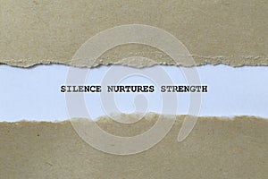 silence nurtures strength on white paper photo