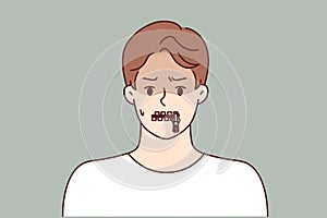 Silent man with zipper on lips is trying to hide compromising information or unpopular opinion photo