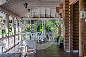 Silent outdoor patio with tables and vases like cafe in beautiful forest for escape, unplugged