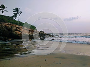 Silent waves near the rocks, view from Kovalam beach, Kerala. Eve& x27;s beach also known as Hawa beach.