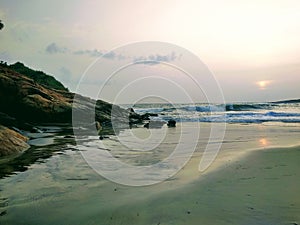 Silent waves near the rocks, view from Kovalam beach, Kerala. Eve& x27;s beach also known as Hawa beach.