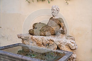 The Silenus statue on via del Babuino, Babuino fountain in Via Condotti, Rome, Italy photo