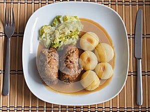 Silesian dumplings with pork roulade and cabbage