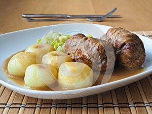 Silesian dumplings with pork roulade and cabbage