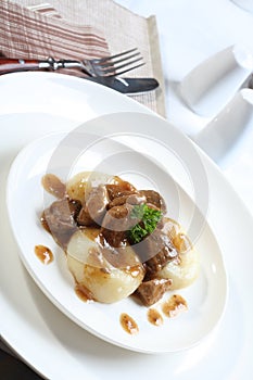 Silesian dumplings on white plate