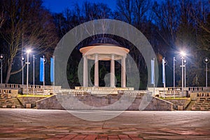 Silesian Park in Chorzow. Dance circle after renovation. A stone floor surrounded by an auditorium. Gloriette in the background