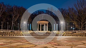 Silesian Park in Chorzow. Dance circle after renovation. A stone floor surrounded by an auditorium. Gloriette in the background