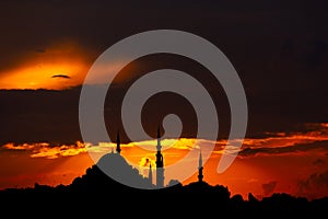 Silhouett of Suleymaniye Mosque at sunset with dramatic clouds