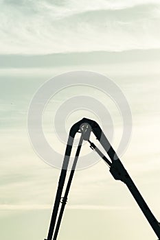 Silhouette of a 4x4 backhoe loader, flexible boom