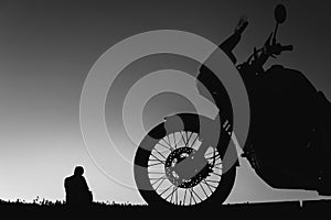 silhouette adventurous motorcycle on blue sunset sky with people, motorcyclists, motorcycle touring background, adventure and