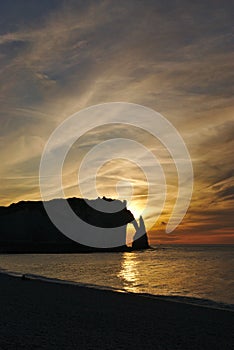 Silhouette of the Aiguille d& x27;Etretat, Falaise d& x27;Aval, with a Beautiful and dramatic sunset at Ã‰tretat & x28;France