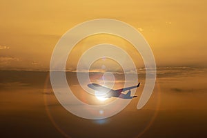 Silhouette of airplane on Colorful dramatic sky at Sunset