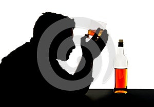 Silhouette of alcoholic drunk man with whiskey glass in alcohol addiction silhouette