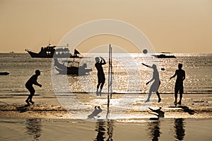 Silhouette of beach Volleyball player in sunset