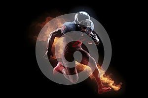 Silhouette of American football player, player in action on fire. Isolated on black background