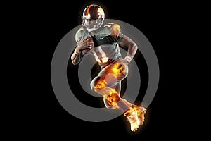 Silhouette of American football player, player in action on fire. Isolated on black background