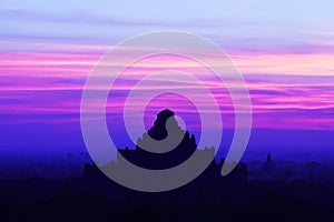 Silhouette of ancient Dhammayangyi Pahto pagoda at sunset in Bag