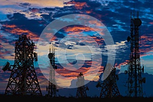 Silhouette of the Antenna of cellular cell phone and communication system tower on cloud and blue sky