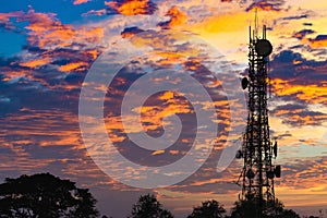 Silhouette of the Antenna of cellular cell phone and communication system tower on cloud and blue sky