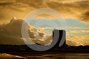 Silhouette of Arlington House in Margate against a dramatic sky