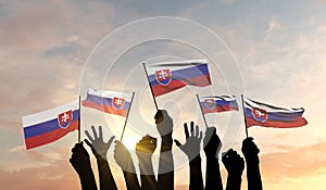 Silhouette of arms raised waving a Slovakia flag with pride. 3D Rendering