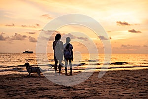 Silhouette of Asian girl on the beach on sunset