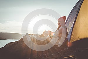 Silhouette Asian woman relaxing in nature winter season during camping