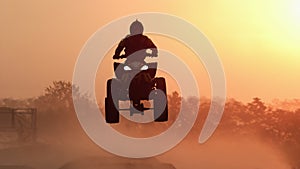 Silhouette ATV or Quad bikes Jump in the sunset.