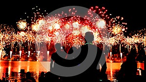 Silhouette of Australian people watching fireworks display over Perth on Australia Day