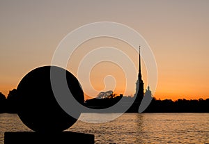 Silhouette of a ball and Peter and Paul Fortress and Neva river in sunrise