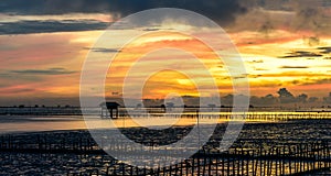 Silhouette of bamboo cottage with morning sunshine in gulf of Thailand