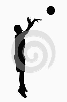 Silhouette of basketball player jumping.