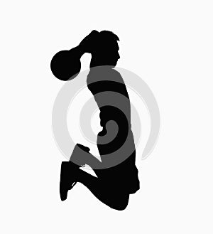 Silhouette of basketball player jumping with ball.