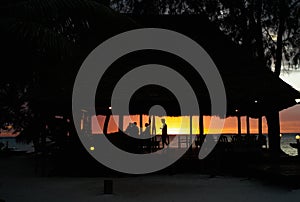 Silhouette of a Beach Bar against a Romantic Sunset