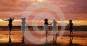 Silhouette, beach and friends running at sunset for summer vacation, holiday and travel together outdoor. Ocean, dusk