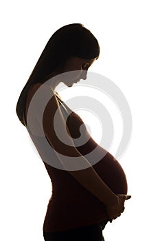 Silhouette of a beautiful pregnant woman