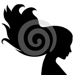 The silhouette of a beautiful woman with long hair flowing in the wind in profile. Template for postcards, greetings
