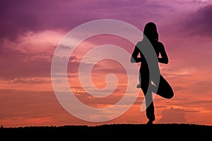 Silhouette of a beautiful Yoga woman