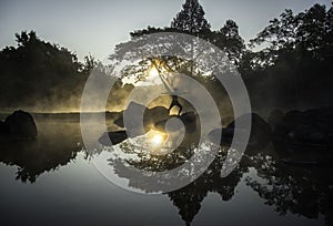 Silhouette of a beautiful Yoga woman in the morning