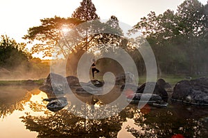 Silhouette of a beautiful Yoga woman