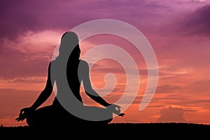 Silhouette of a beautiful Yoga woman