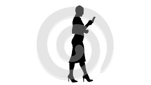 Silhouette Beautiful young woman is using an app in her smartpho