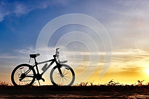 Silhouette bicycle with beautiful sunset or sunrise sky