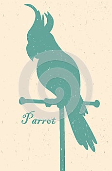 Silhouette of the bird. A parrot on a perch