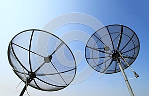 Silhouette of black satellite dishs